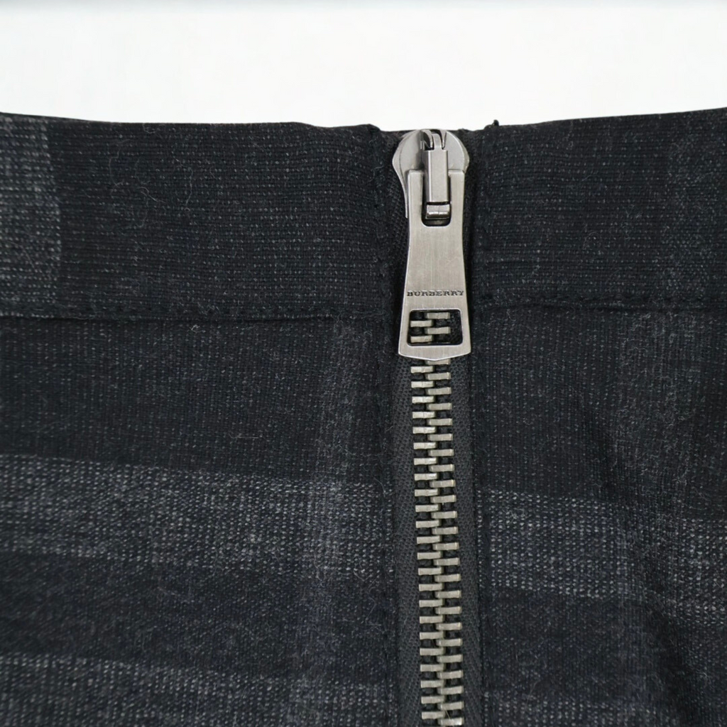 Vintage Burberry Brit black and gray plaid pleated mini skirt with exposed zip, late-2000s