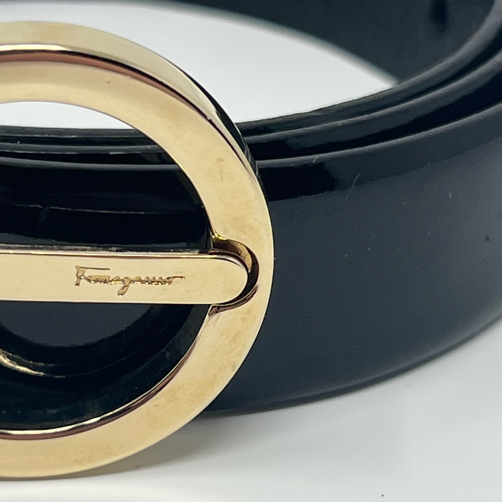 Vintage Salvatore Ferragamo black patent leather belt with gold Gancini buckle, 2000s